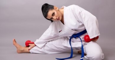 Taekwondo student wearing a blue belt practicing sparring drills during training