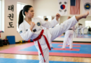 The Taekwondo Red Belt: Why This Rank Separates the Dedicated from the Determined Taekwondo practitioner wearing a red belt performing a high side kick during training