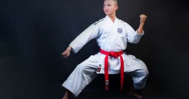Taekwondo student demonstrating the Red Belt Form Taegeuk Chil Jang tiger stance and technique